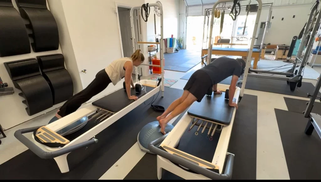 A plank-focused Pilates exercise at the studio